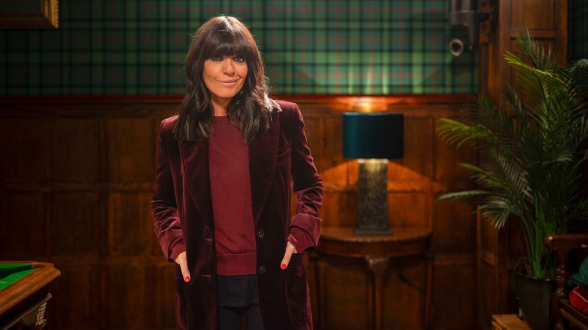 Claudia Winkleman poses in The Traitors castle